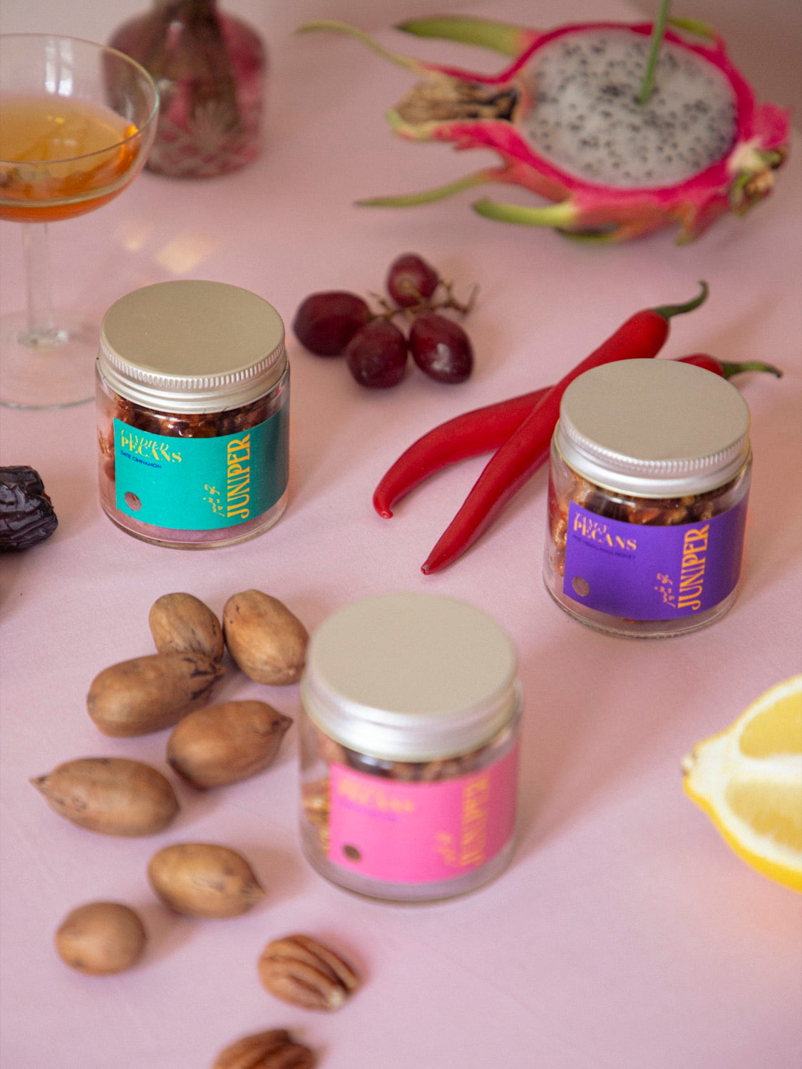 Juniper jars styled as a gift with fruit and flowers